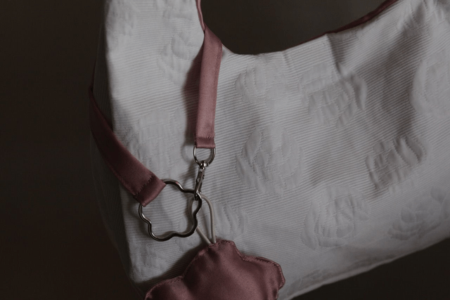 reversible shoulder bag and flower keychain